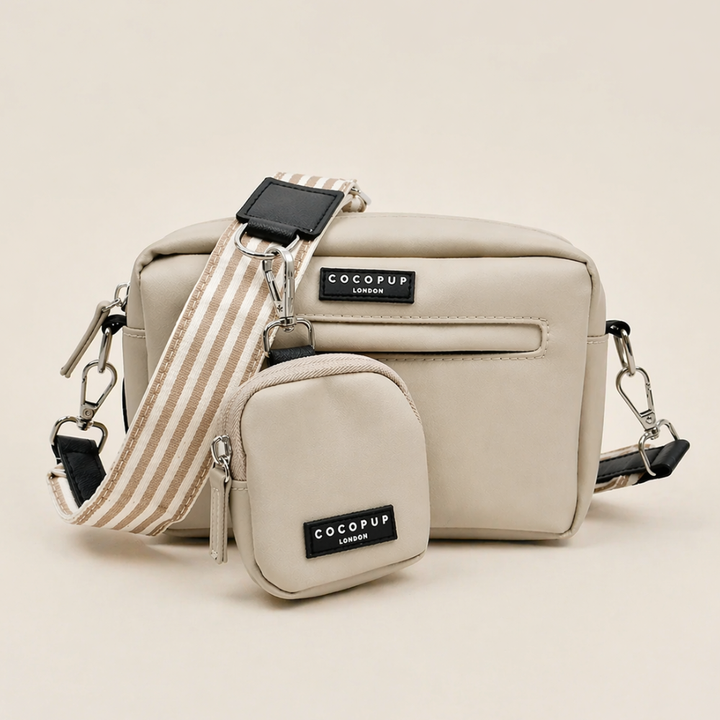 Caramel brown Cocopup London dog walking bag with striped strap and matching coin purse.