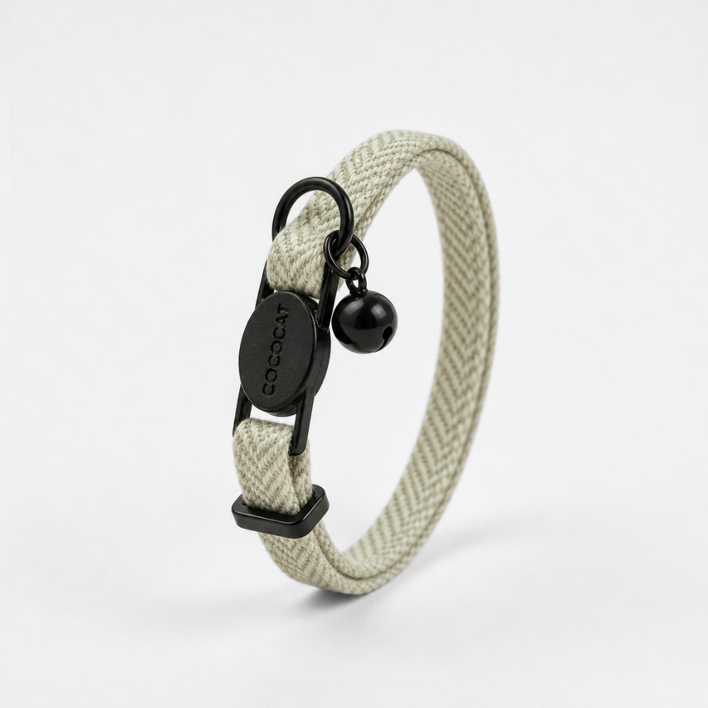 Sage tweed cat collar with breakaway buckle, black ring, and bell shown on a white background.