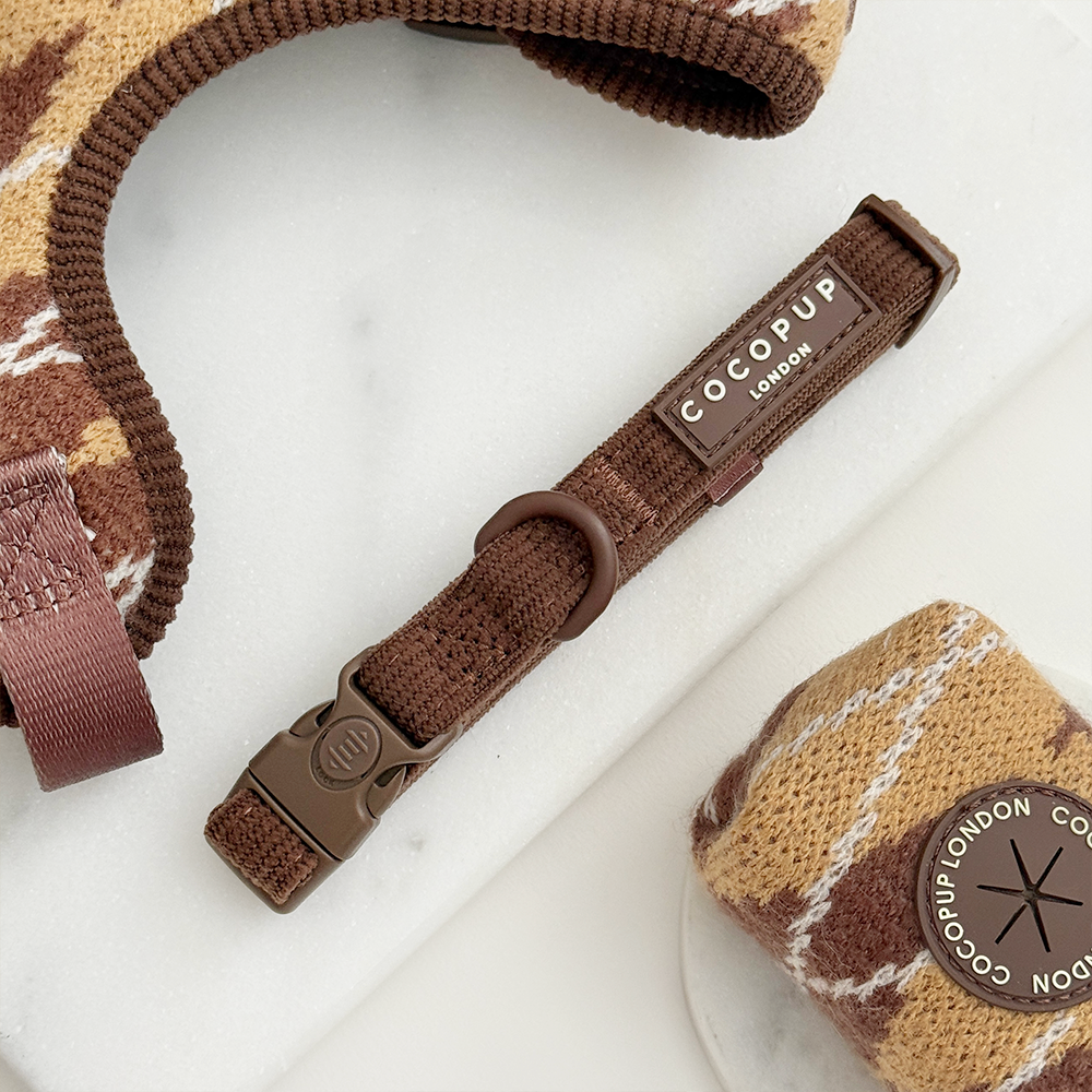 Brown ribbed dog collar with Cocopup logo badge.