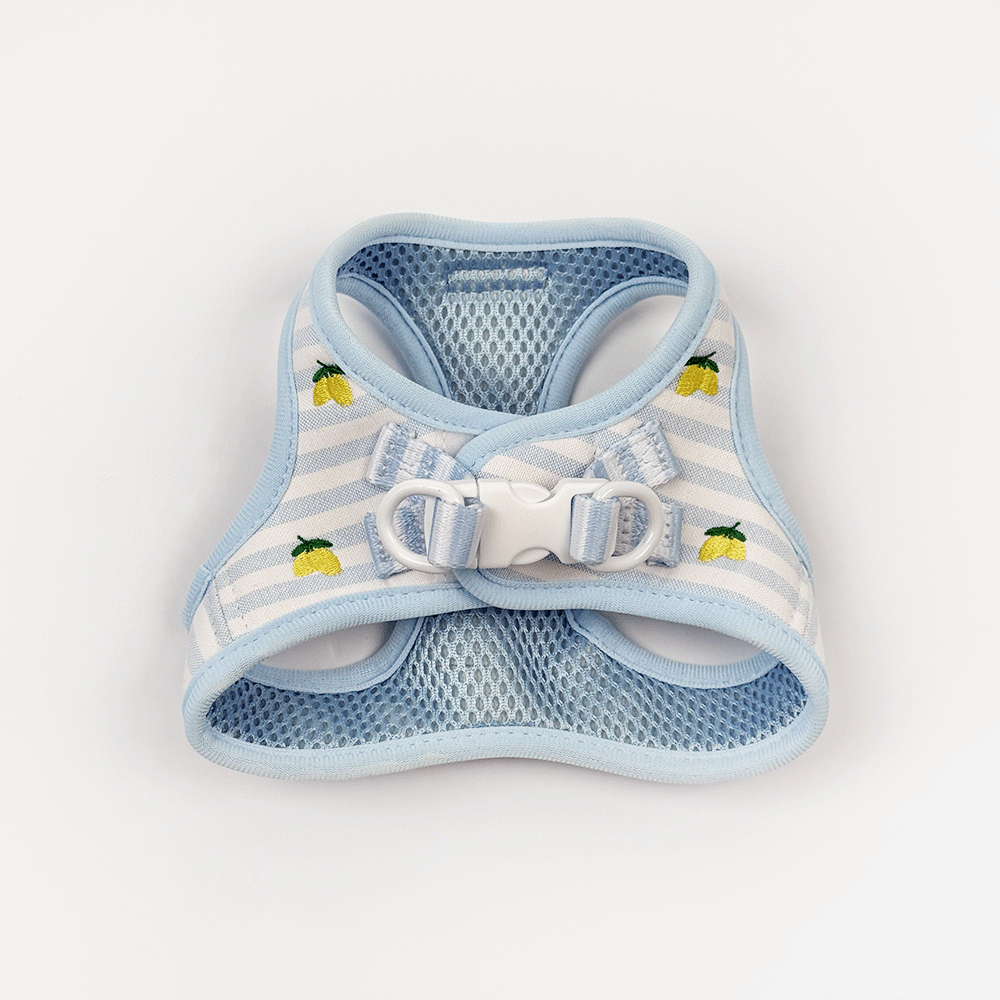 Light blue and white striped cat harness with lemon print, mesh lining, and a plastic buckle.