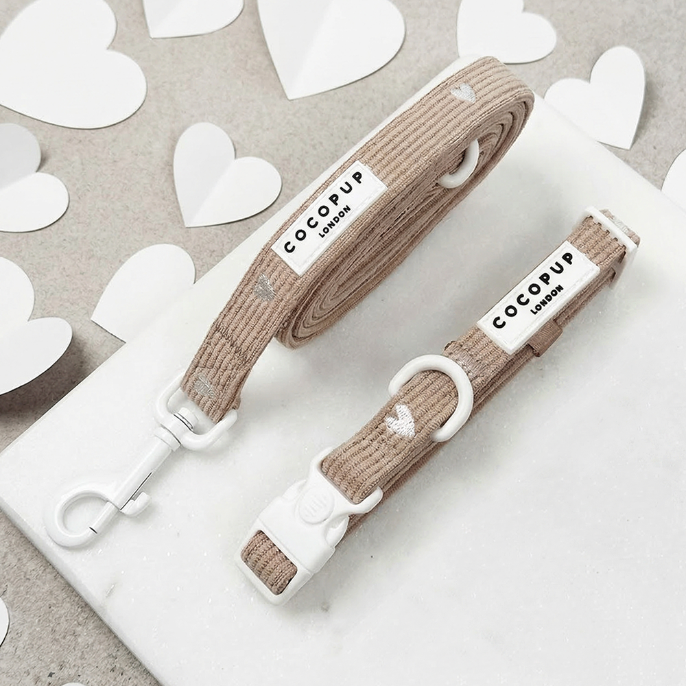 Dog Lead & Collar set in neutral brown shade with embroidered white hearts, with Cocopup branding.