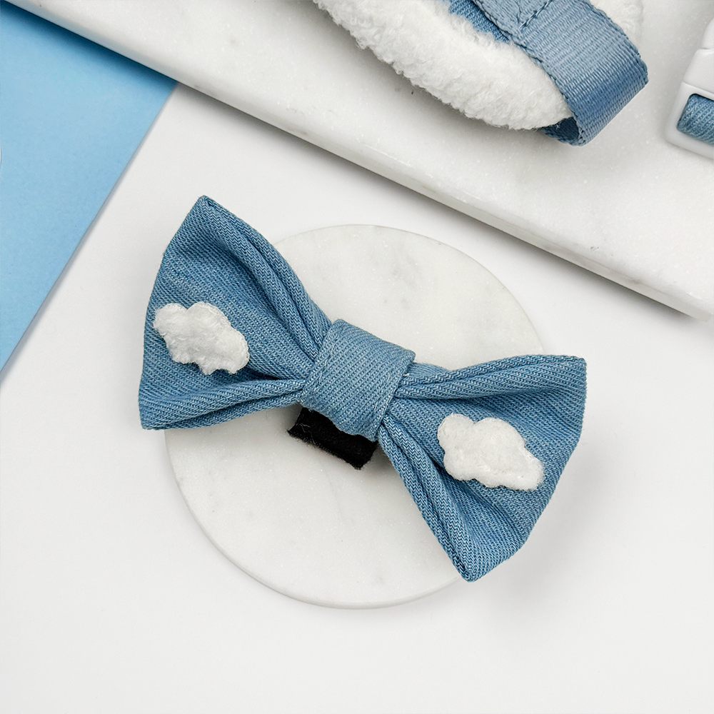 Blue denim dog bow tie with a Cocopup label on a white background