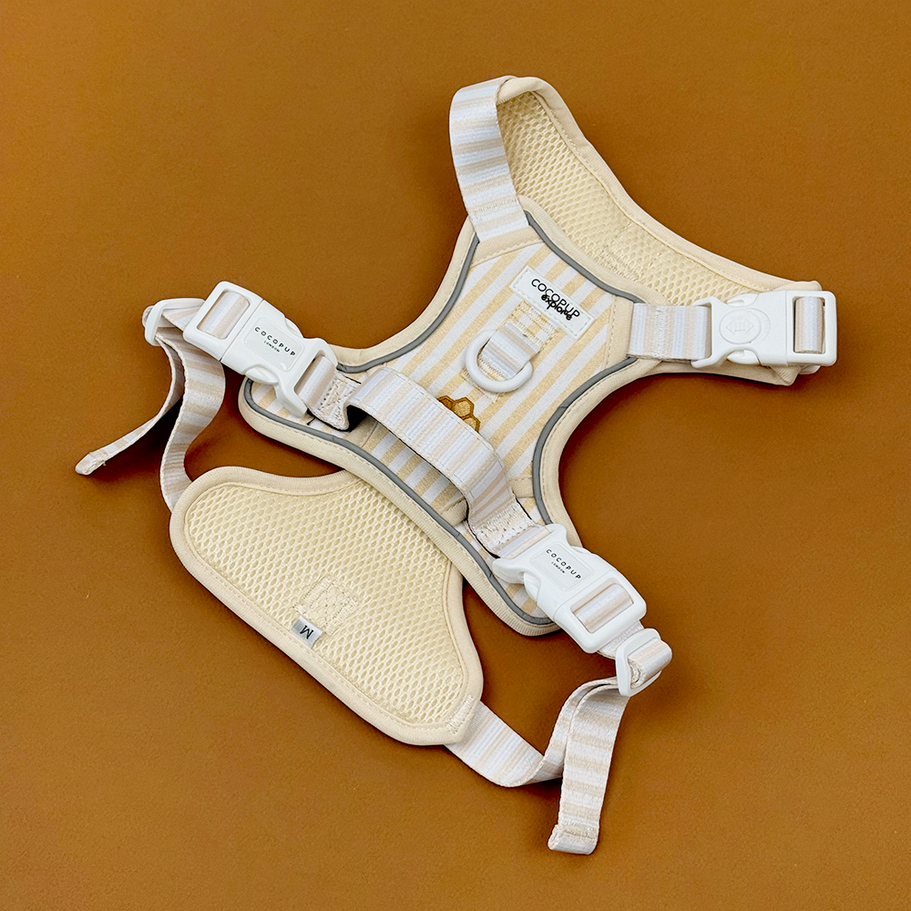 Pale yellow and white striped Dog Harness with embroidered honeycomb and bees, featuring Cocopup Explore logo. 