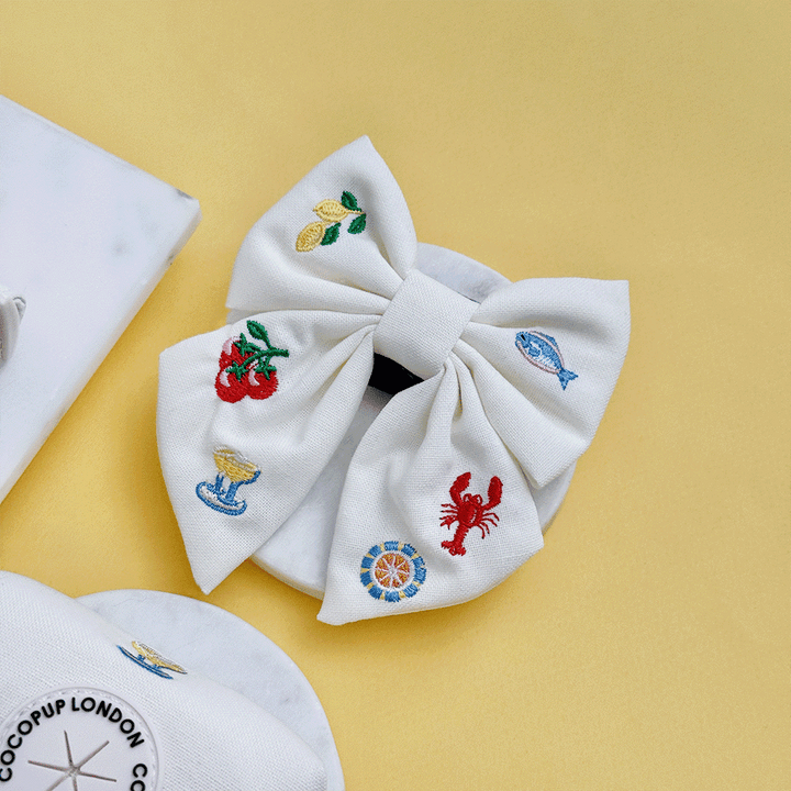 White linen fabric Dog Sailor Bow Tie with summer embroidered embellishments.