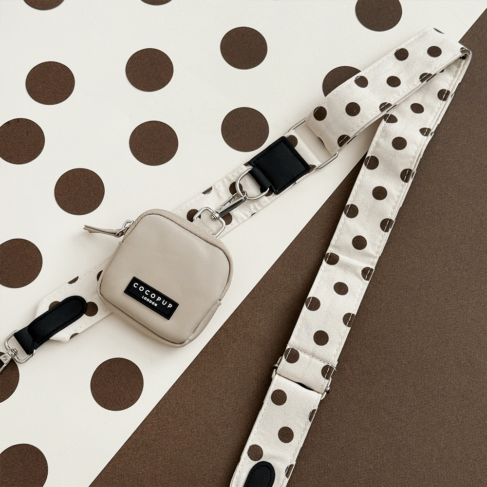 Polka dot strap on a brown and white polka dot background